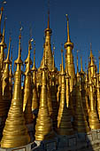 Inle Lake Myanmar. Indein, on the summit of a hill the  Shwe Inn Thein Paya a cluster of hundreds of ancient stupas. Many of them are ruined and overgrown with bushes. 